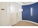 Hallway area with double doors, unit number and accent wall, creating a welcoming residential entrance at 3801 N Goldwater Blvd # 201, Scottsdale, AZ 85251