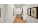 Inviting hallway showcases stylish decor and flooring, leading to the home's entrance and other rooms at 3801 N Goldwater Blvd # 201, Scottsdale, AZ 85251