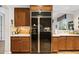 Modern kitchen features stainless steel appliances, custom wood cabinets, and ample counter space at 3801 N Goldwater Blvd # 201, Scottsdale, AZ 85251
