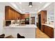 Open kitchen with wood cabinets, stainless appliances, ample counter space, and a view of the dining area at 3801 N Goldwater Blvd # 201, Scottsdale, AZ 85251