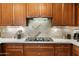 Beautiful kitchen features custom cabinets, modern appliances, stylish tile backsplash, and ample counter space at 3801 N Goldwater Blvd # 201, Scottsdale, AZ 85251