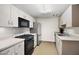 Functional kitchen with stainless steel refrigerator, black oven, and sink at 3801 N Goldwater Blvd # 201, Scottsdale, AZ 85251