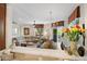 Open-concept living space features a view of the dining area and a modern living room with comfortable seating at 3801 N Goldwater Blvd # 201, Scottsdale, AZ 85251
