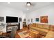 Inviting living room boasts a large TV, cozy sofa, and eye-catching artwork for a modern look at 3801 N Goldwater Blvd # 201, Scottsdale, AZ 85251