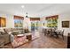 Bright living room featuring tile floors, neutral decor, and large windows with outdoor views at 3801 N Goldwater Blvd # 201, Scottsdale, AZ 85251