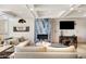 Comfortable lounge area with a fireplace, television, and stylish decor for a relaxing ambiance at 3801 N Goldwater Blvd # 201, Scottsdale, AZ 85251