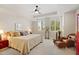 The primary bedroom features natural light, tray ceilings, and cozy, decorative furnishings at 3801 N Goldwater Blvd # 201, Scottsdale, AZ 85251
