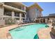 Inviting community pool with surrounding lounge chairs for residents to enjoy the outdoors at 3801 N Goldwater Blvd # 201, Scottsdale, AZ 85251