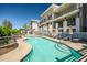 Inviting pool area with manicured landscaping and upscale condominiums in the background at 3801 N Goldwater Blvd # 201, Scottsdale, AZ 85251