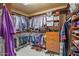 Spacious walk-in closet with organized shelving, hanging rods, drawers, and shoe racks at 3801 N Goldwater Blvd # 201, Scottsdale, AZ 85251