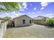 Spacious backyard featuring a gravel landscape and block wall fence, offering a low-maintenance outdoor space and privacy at 41839 W Avella Dr, Maricopa, AZ 85138