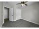 Bedroom featuring gray carpet, and a large closet at 41839 W Avella Dr, Maricopa, AZ 85138