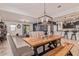 Spacious dining room featuring modern lighting fixture and wood dining table with seating at 4216 W Harwell Rd, Laveen, AZ 85339