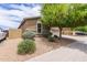Charming single-Gathering home with a desert landscape and a sidewalk in front at 4216 W Harwell Rd, Laveen, AZ 85339