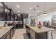 Gourmet kitchen featuring granite counters, stainless appliances, and a convenient center island at 4216 W Harwell Rd, Laveen, AZ 85339