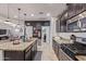 This kitchen has granite counters, ample cabinet space, stainless appliances, and an open design at 4216 W Harwell Rd, Laveen, AZ 85339
