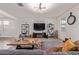 The living room features shelves, decorations, and a large TV at 4216 W Harwell Rd, Laveen, AZ 85339