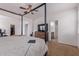 Inviting primary bedroom with a four-poster bed, dresser, and convenient en-suite bathroom at 4216 W Harwell Rd, Laveen, AZ 85339