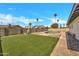 The backyard has a pool, turf, and hardscape at 4720 W Northview Ave, Glendale, AZ 85301