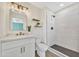 Stylish bathroom features a modern vanity, a decorative mirror, and a luxurious tiled walk-in shower at 4720 W Northview Ave, Glendale, AZ 85301