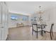 Bright dining area with modern chandelier, neutral walls, and ample space for entertaining guests at 4720 W Northview Ave, Glendale, AZ 85301