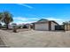 View of house showcasing a two-car garage, low maintenance landscaping, and a desert climate at 4720 W Northview Ave, Glendale, AZ 85301