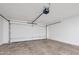 A spacious and freshly painted garage with a functional door system at 4720 W Northview Ave, Glendale, AZ 85301