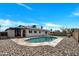 Backyard pool with updated tiling and river rock, offering a refreshing outdoor oasis at 4720 W Northview Ave, Glendale, AZ 85301