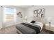 Comfortable bedroom with neutral colors, modern bedside lamps, and ample natural light at 5055 N Jayson Rd, Casa Grande, AZ 85194
