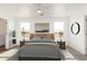 Serene bedroom with a natural headboard, neutral palette, and ample natural light at 5055 N Jayson Rd, Casa Grande, AZ 85194
