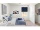 Charming bedroom with blue and white decor, storage shelves, and a cozy sleeping space at 5055 N Jayson Rd, Casa Grande, AZ 85194