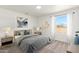 Comfortable bedroom featuring neutral walls, carpet flooring, and natural light from the window at 5055 N Jayson Rd, Casa Grande, AZ 85194