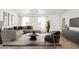 Inviting living room with stylish seating arrangement, modern decor, and bright windows for natural light at 5055 N Jayson Rd, Casa Grande, AZ 85194