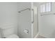 Bathroom features a toilet, grab bar and shower at 6051 E Ensenada St, Mesa, AZ 85205