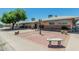 Community center complex with brick-paved courtyard, ample seating, and inviting landscaping at 6051 E Ensenada St, Mesa, AZ 85205