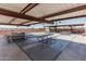 Covered patio features picnic tables and shuffleboard courts for outdoor entertainment and community gatherings at 6051 E Ensenada St, Mesa, AZ 85205