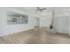 Bright living room featuring modern flooring, a brick fireplace, and ample natural light at 6051 E Ensenada St, Mesa, AZ 85205