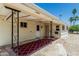 Inviting covered patio with red patterned rug providing an outdoor relaxation area at 6051 E Ensenada St, Mesa, AZ 85205