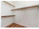 Walk-in closet with hardwood floors and shelving at 6180 W Oraibi Dr, Glendale, AZ 85308