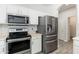 Kitchen features stainless steel refrigerator, range, and microwave at 6180 W Oraibi Dr, Glendale, AZ 85308