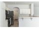 Well-lit kitchen with stainless steel appliances and white cabinets at 6180 W Oraibi Dr, Glendale, AZ 85308
