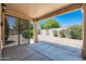 Covered patio area with view of the backyard and mature landscaping at 6180 W Oraibi Dr, Glendale, AZ 85308