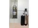 Utility room featuring a hot water heater and water conditioning system at 6180 W Oraibi Dr, Glendale, AZ 85308