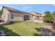 The backyard boasts a pool, covered patio, solar panels, and landscaped yard at 6827 W El Cortez Pl, Peoria, AZ 85383