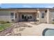 The backyard patio includes seating and is adjacent to the pool and landscaped yard at 6827 W El Cortez Pl, Peoria, AZ 85383