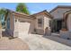 Charming single-story home with a two-car garage and desert landscaping at 6827 W El Cortez Pl, Peoria, AZ 85383