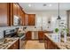 Beautiful kitchen featuring granite countertops, stainless appliances, and a center island with seating at 6827 W El Cortez Pl, Peoria, AZ 85383