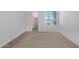 Cozy carpeted bedroom with natural light from the window, built in shelves and closet for storage at 747 S Extension Rd # 113, Mesa, AZ 85210