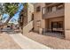 Charming exterior view of the complex showcasing the architecture and landscaping at 747 S Extension Rd # 113, Mesa, AZ 85210