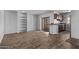 Inviting living room with built-in shelving and sliding glass doors for natural light, seamlessly connecting to the kitchen area at 747 S Extension Rd # 113, Mesa, AZ 85210